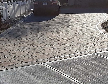 Stamped Concrete or Pavers: Which Driveway Style Fits Your Home Best?